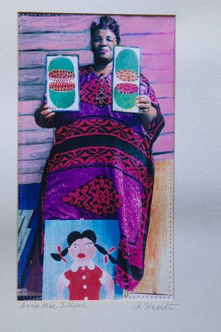 Outsider Folk Artist Annie Tolliver  holding her art work.